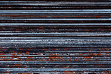 A stack of leaves of wave slate. Side view of a large number of 