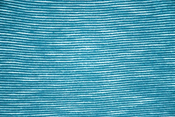 Art deco close-up of stripped fabric texture. Blue texture background.