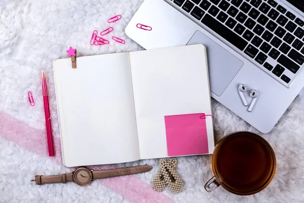 Home office desk workspace with laptop and tea cup on white background. Flat lay, top view girl boss work business concept. Work at home concept on coronavirus quarantine