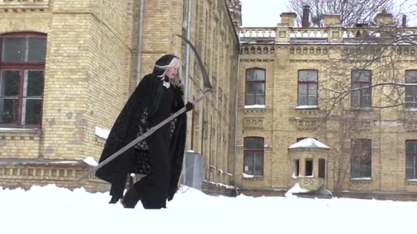 Horrible woman with a scythe. — Stockvideo