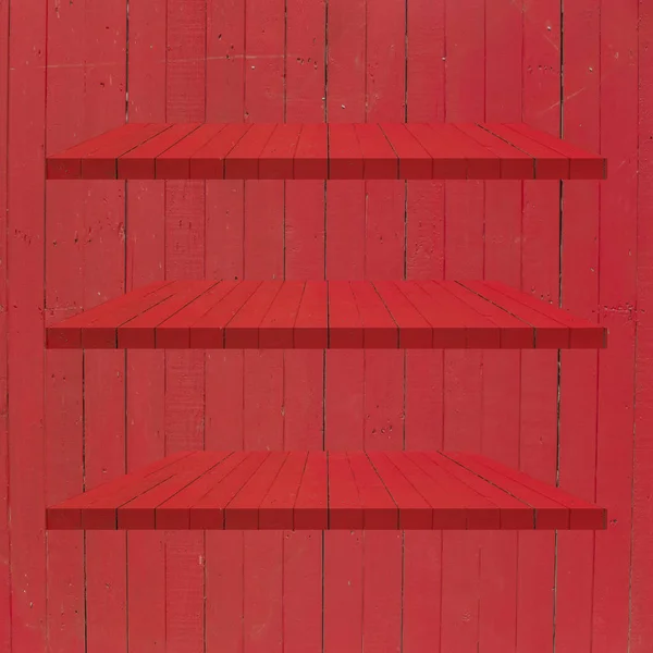 3 röda trä hyllor tabell på röd trävägg bakgrund — Stockfoto