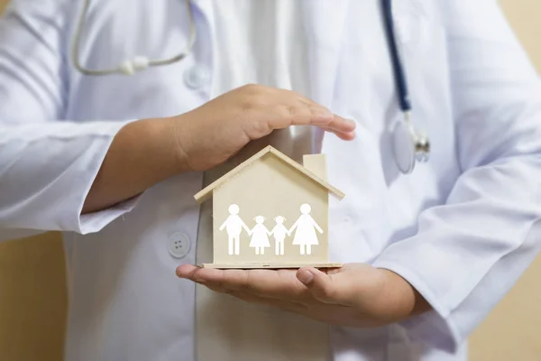 Doctor is protecting house with family paper Health care and Car