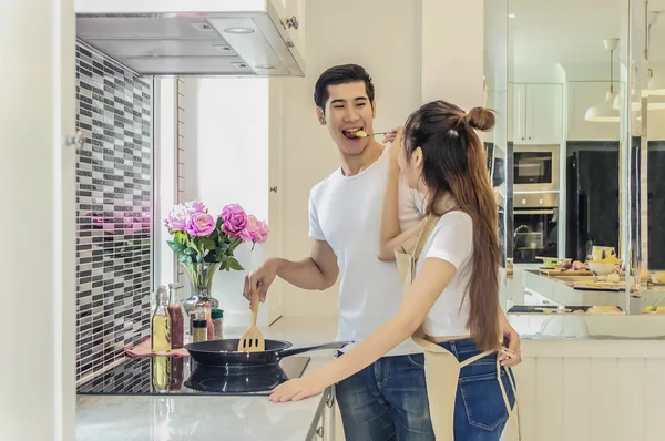 Sweet couple home kitchen cooking lover concept.