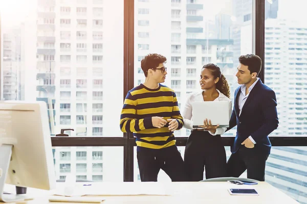 Business people talking while standing by conference.