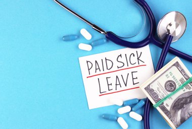 text paid sick leave and money with pills on a blue background. dollars and medical capsules on the table clipart