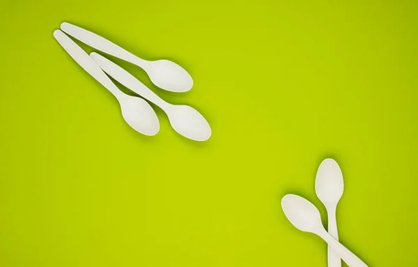 Biodegradable Spoons Green Background Top View Space Text Caring Nature — Stock Photo, Image