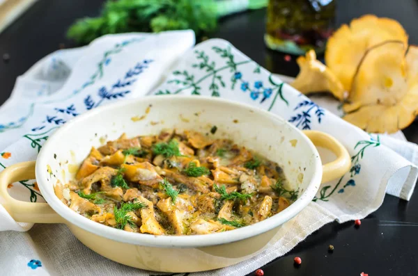 Homemade baked chanterelle mushrooms in frying pan isolated — Stock Photo, Image