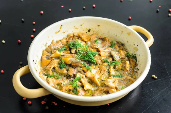 Homemade baked chanterelle mushrooms in frying pan isolated — Stock Photo, Image