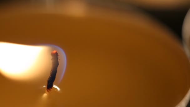 Candle flame burning calmly at religious service in church, light in darkness — Stock Video