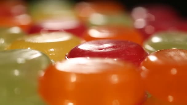 Colorful sweet candies moving on production line, confectionery plant, industry — Stock Video