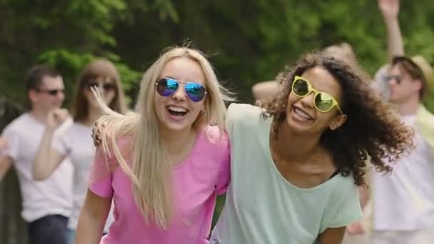 Energetic youth enjoying party in park, summer activities, dancing outdoors — Stock Video