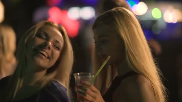 Beautiful blondes flirting on dance floor, making sexy body moves to party music — Stock Video