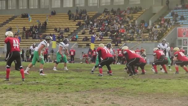 KYIV, UKRAINE - CIRCA OCTOBER 2015: Teams playing American football. Active player saves ball from crossing team's goal line, American football match — Αρχείο Βίντεο