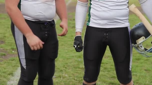 Resolute football team standing in field before match for traditional axe trophy — Αρχείο Βίντεο