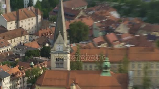 Clock on ancient church tower in European city, cultural heritage preservation — Stock Video