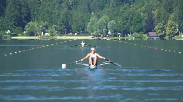 Two athletes competing in rowing, professional sport and healthy lifestyle — Stock Video