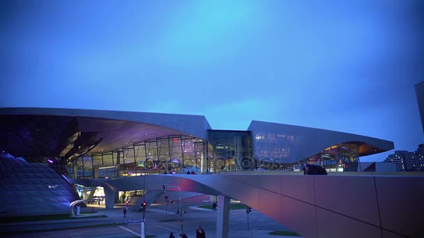 Panoramic view on illuminated glass shopping center, urban life, modern building — Stock Video