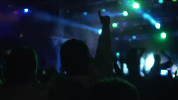Slow-mo of excited crowd enjoying cool concert, friends hugging and jumping — Stock Video