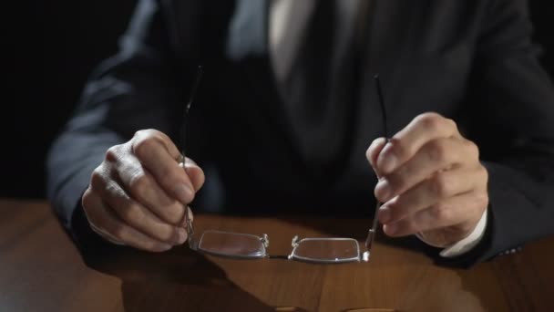 Serious politician putting glasses on table, planning election campaign strategy — Stock Video