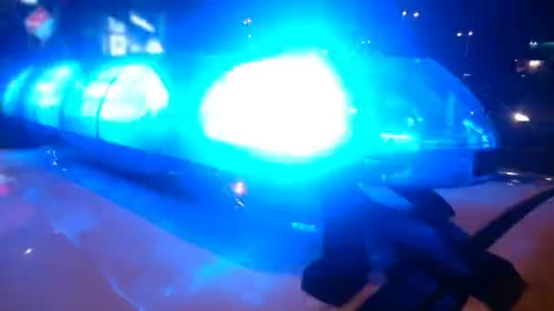 Closeup of lightbar on police car cabin flashing at night, law enforcers on duty — Stock Video