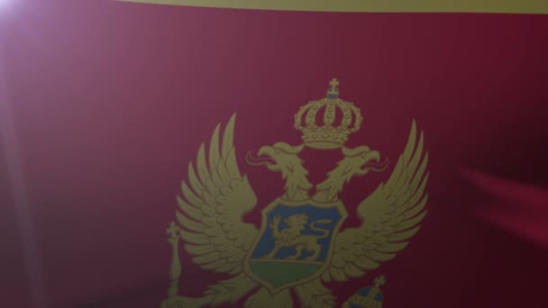 Vlag van Montenegro zwaaien op vlaggenmast in de wind, het nationale symbool van vrijheid — Stockvideo