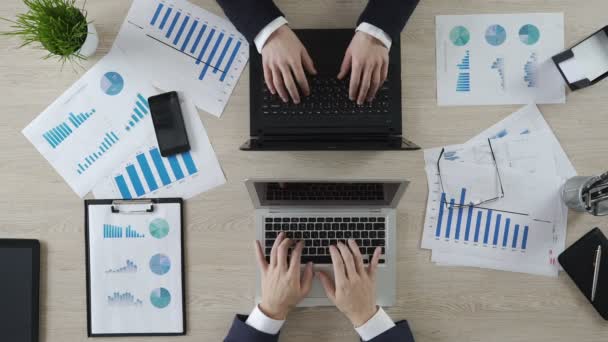 Hands of business partners typing on laptops opposite each other, negotiations — Stock Video