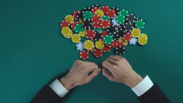 Winner grabbing pile of chips after poker game, greedy man taking all money — Stock Video