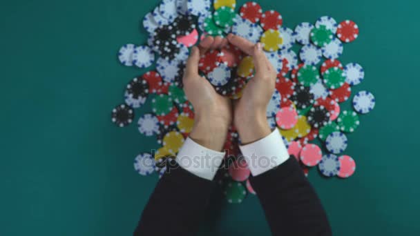 Male holding handful of poker chips, wins small fortune in casino, gambling — Stock Video