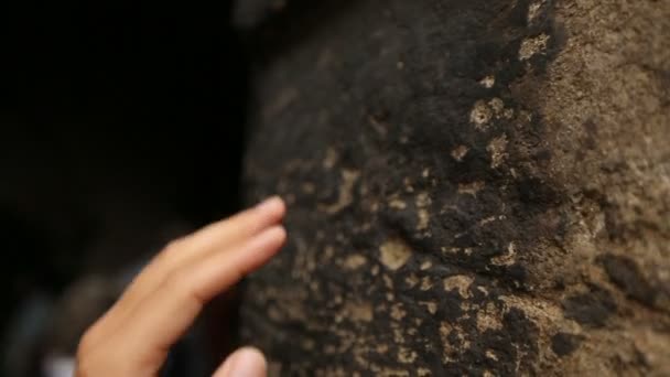 Curious male tourist rubbing wall of Stone Gate, place of fire in Zagreb — Stock Video