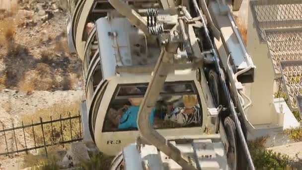 Tourists arriving to Fira by cable car, public transport on Santorini island — Stock Video