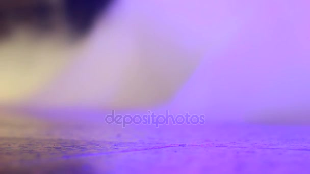 Multicolored Smoke Slowly Spreading Across Floor Filling Room With Pungent Smell
