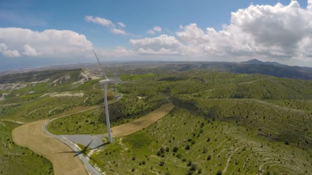 Large wind turbines standing in the fields, eco-friendly electricity generation — Stock Video