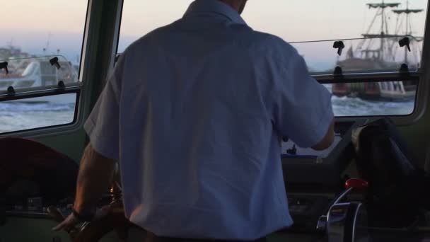 Captain turning steering wheel to control yacht in sea, navigation, slow motion — Stock Video