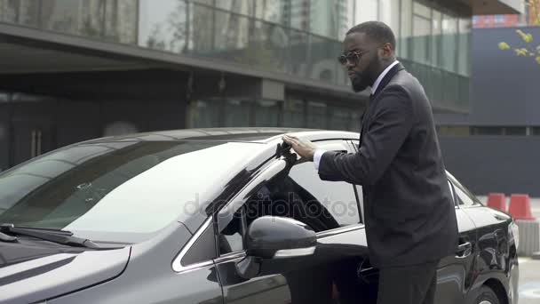 Personal driver of important person on chic machine loving and enjoying his work — Stock Video