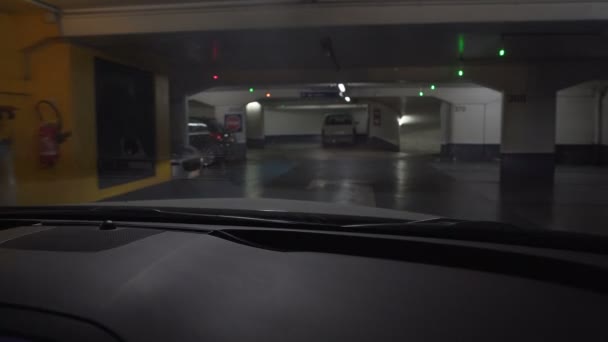 Driver of luxury car leaving hotel underground parking, going on business — Stock Video