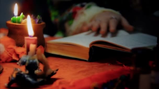 Divination, witch reading spell to luck, magic candles lightning at home — Stock Video