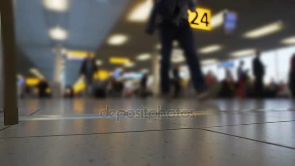 Passengers walking at departure lounge, airport terminal, travel by airlines
