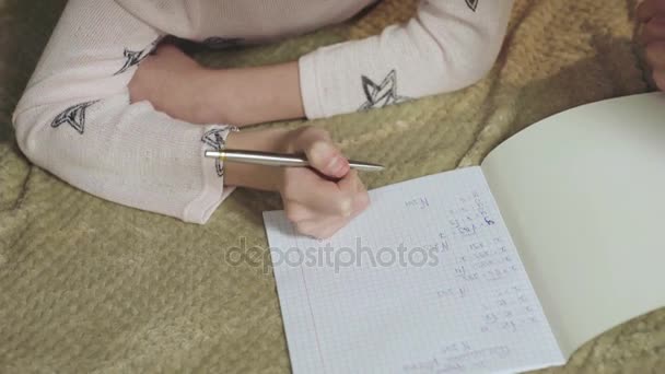 Smart girl  solving mathematical equations in bed, homeschooling education — Stock Video