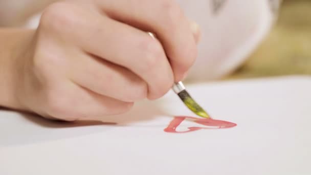 Hands of romantic girl mixing colors, painting beautiful red heart, love dreams — Stock Video