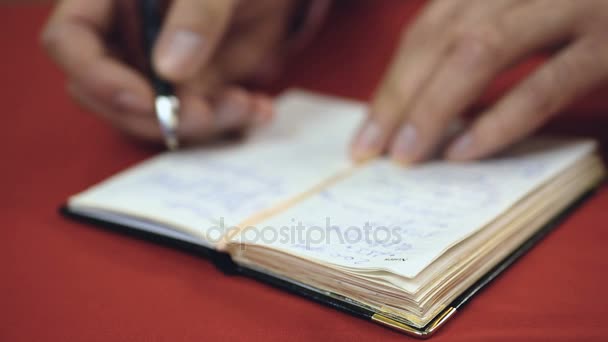 Businessman checking his handwritten to-do list making new notes and reminders — Stock Video