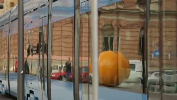 Public transport in big city, modern tram carrying passengers, Zagreb streets — Stock Video
