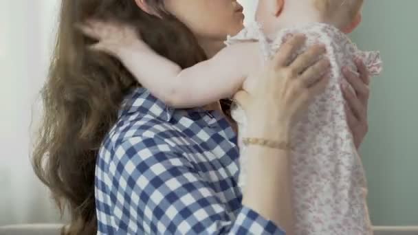 Mother kissing and hugging small kid, comforting soothing movements, upset child — Stock Video