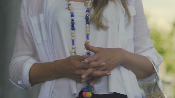 Fancy woman with accessories waiting in street, meeting with friends for drink — Stock Video