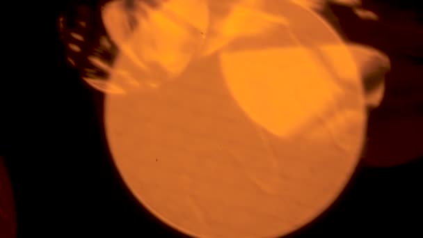 Large orange sun turning into small light bulb on New Year tree, christmas magic — Stock Video