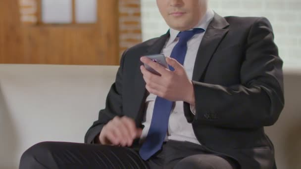 Wealthy man in smart suit making call on mobile phone, influential businessman — Stock Video