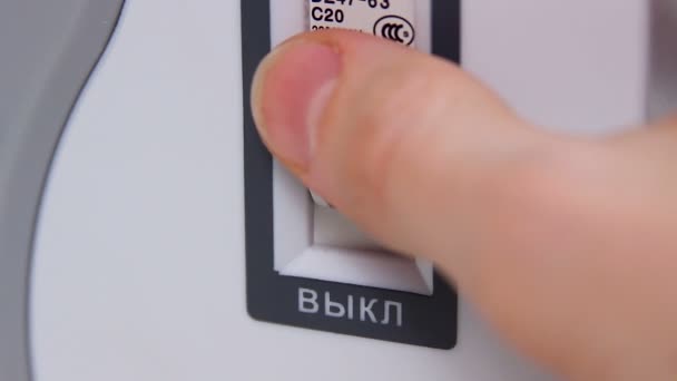 Close-up of male finger pressing power switch, toggling electric system status — Stock Video