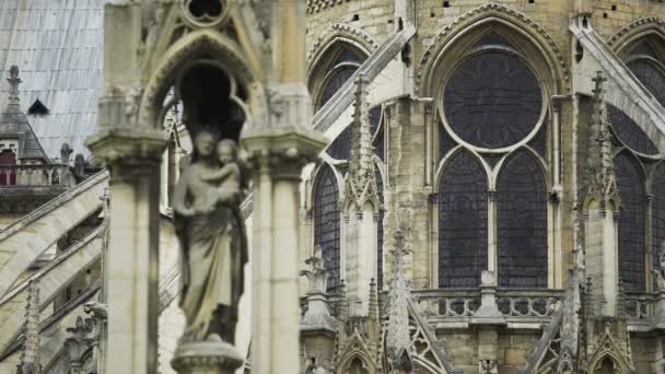 Facade of Notre-Dame de Paris cathedral, statue of Our Lady, gothic architecture — Stock Video