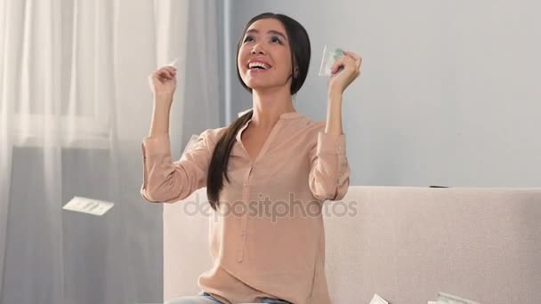 Asian lady rejoicing at unexpected news that she inheriting fortune, slow-mo — Stock Video