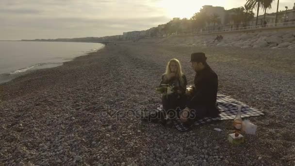 Man and woman drinking wine on sea shore in Nice, luxurious weekend getaway — Stock Video