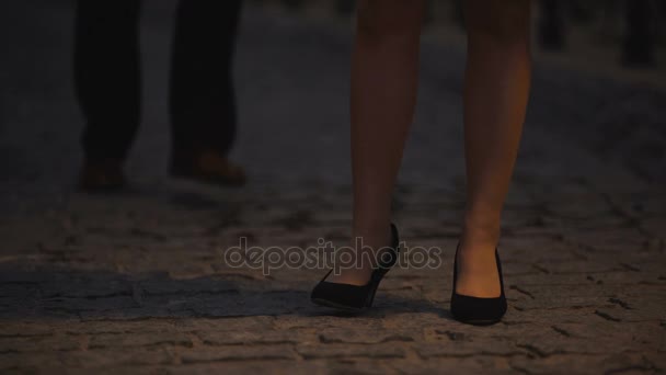 Woman waiting for her date impatiently, old city stone-block pavement, romance — Stock Video